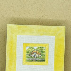 Cuadro decorativo amarillo con paisaje al fondo
